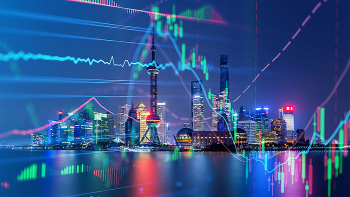 Colourful graphs overlay the illuminated night skyline of Shanghai.